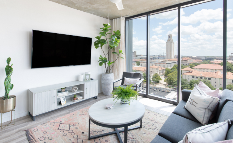 a furnished apartment living room with a TV